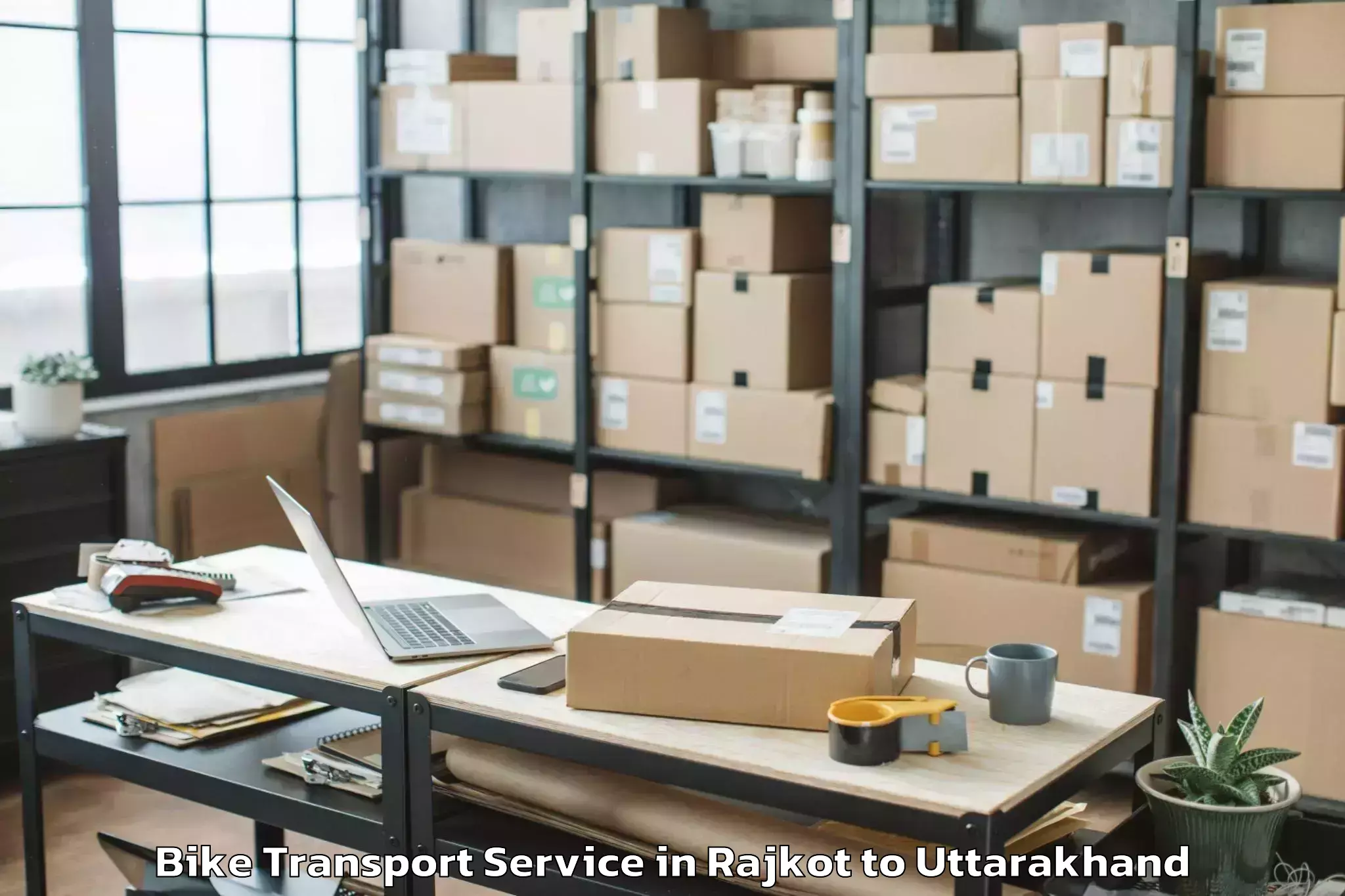 Book Rajkot to Hemwati Nandan Bahuguna Uttara Bike Transport Online